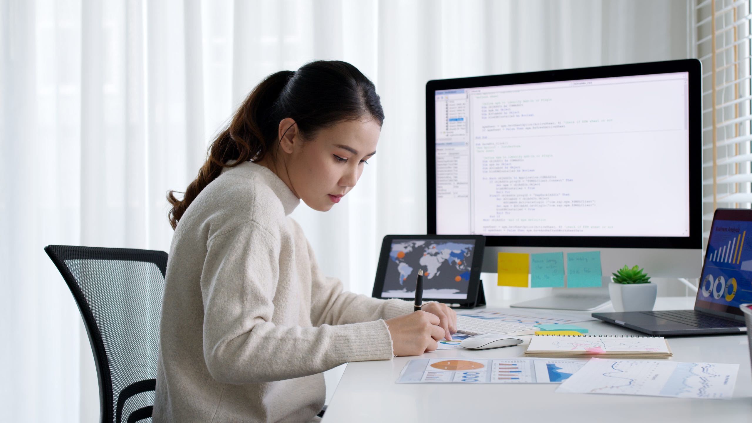 Woman works at her computer