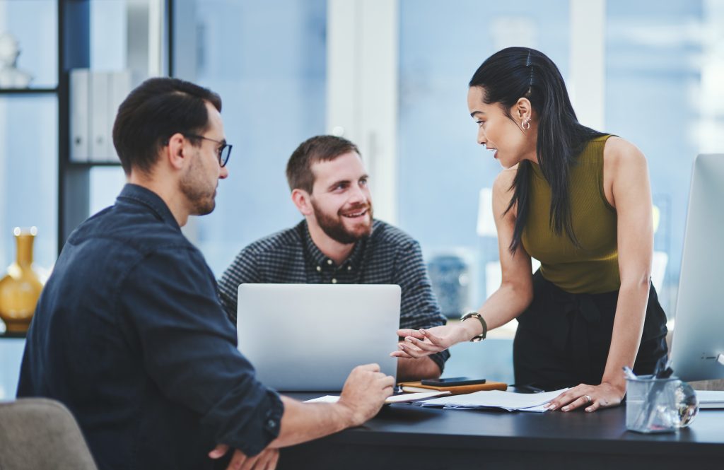 Creative, business people and team discussion in meeting for brainstorming, help or advice. Group, project manager or planning with documents for campaign performance, strategy or solution in startup.